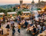Festa in borgo medievale con musica, balli e bancarelle di prodotti tipici. Un'atmosfera che fa pensare a che feste ci sono a maggio.